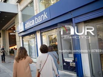 An Attica Bank branch is in Athens, Greece, on December 18, 2024. Greek lenders face an impact of about 350 million euros ($368 million) in...