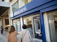 An Attica Bank branch is in Athens, Greece, on December 18, 2024. Greek lenders face an impact of about 350 million euros ($368 million) in...