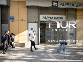 An Alpha Bank branch is in Athens, Greece, on December 18, 2024. Greek lenders face an impact of about 350 million euros ($368 million) in 2...