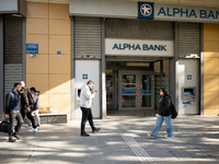 An Alpha Bank branch is in Athens, Greece, on December 18, 2024. Greek lenders face an impact of about 350 million euros ($368 million) in 2...