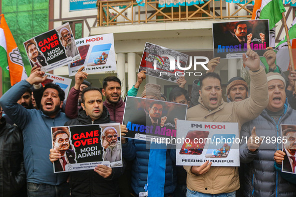 Members of the youth wing of the Indian National Congress party shout slogans and hold placards during a protest in Srinagar, Jammu and Kash...