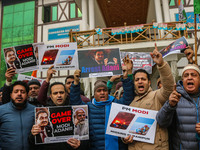 Members of the youth wing of the Indian National Congress party shout slogans and hold placards during a protest in Srinagar, Jammu and Kash...