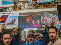 Members of the youth wing of the Indian National Congress party shout slogans and hold placards during a protest in Srinagar, Jammu and Kash...