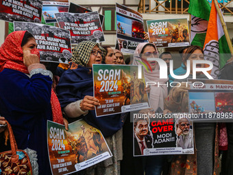 Members of the youth wing of the Indian National Congress party shout slogans and hold placards during a protest in Srinagar, Jammu and Kash...