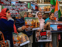 Members of the youth wing of the Indian National Congress party shout slogans and hold placards during a protest in Srinagar, Jammu and Kash...