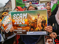 Members of the youth wing of the Indian National Congress party shout slogans and hold placards during a protest in Srinagar, Jammu and Kash...