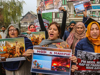 Members of the youth wing of the Indian National Congress party shout slogans and hold placards during a protest in Srinagar, Jammu and Kash...