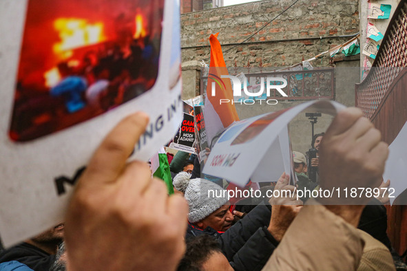 Members of the youth wing of the Indian National Congress party shout slogans and hold placards during a protest in Srinagar, Jammu and Kash...