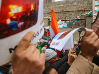 Members of the youth wing of the Indian National Congress party shout slogans and hold placards during a protest in Srinagar, Jammu and Kash...