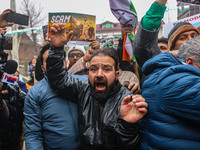 Members of the youth wing of the Indian National Congress party shout slogans and hold placards during a protest in Srinagar, Jammu and Kash...