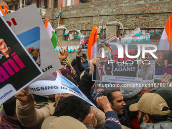 Members of the youth wing of the Indian National Congress party shout slogans and hold placards during a protest in Srinagar, Jammu and Kash...