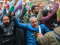 Members of the youth wing of the Indian National Congress party shout slogans and hold placards during a protest in Srinagar, Jammu and Kash...