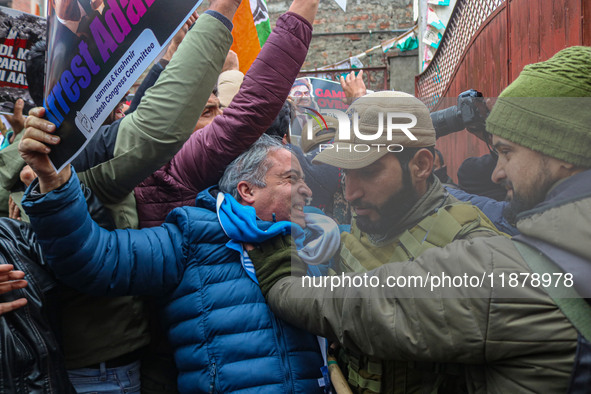 Members of the youth wing of the Indian National Congress party shout slogans and hold placards during a protest in Srinagar, Jammu and Kash...