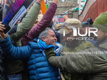 Members of the youth wing of the Indian National Congress party shout slogans and hold placards during a protest in Srinagar, Jammu and Kash...