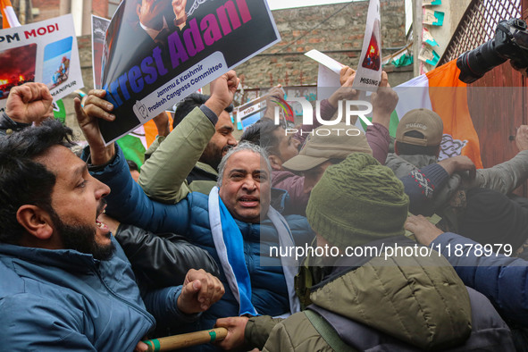 Members of the youth wing of the Indian National Congress party shout slogans and hold placards during a protest in Srinagar, Jammu and Kash...