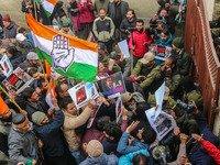 Members of the youth wing of the Indian National Congress party shout slogans and hold placards during a protest in Srinagar, Jammu and Kash...