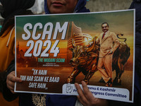 Members of the youth wing of the Indian National Congress party shout slogans and hold placards during a protest in Srinagar, Jammu and Kash...