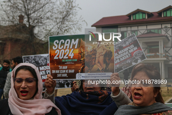 Members of the youth wing of the Indian National Congress party shout slogans and hold placards during a protest in Srinagar, Jammu and Kash...