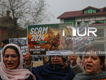 Members of the youth wing of the Indian National Congress party shout slogans and hold placards during a protest in Srinagar, Jammu and Kash...