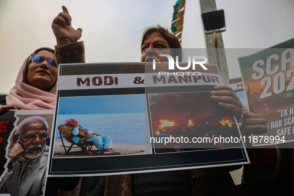 Members of the youth wing of the Indian National Congress party shout slogans and hold placards during a protest in Srinagar, Jammu and Kash...