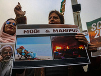 Members of the youth wing of the Indian National Congress party shout slogans and hold placards during a protest in Srinagar, Jammu and Kash...