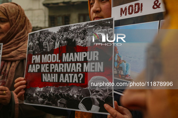 Members of the youth wing of the Indian National Congress party shout slogans and hold placards during a protest in Srinagar, Jammu and Kash...