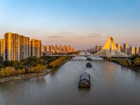 Transport ships sail on the Beijing-Hangzhou Grand Canal in Huai'an City, Jiangsu Province, China, on December 18, 2024. (