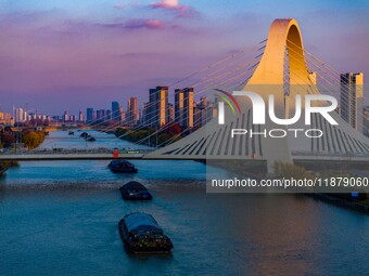 Transport ships sail on the Beijing-Hangzhou Grand Canal in Huai'an City, Jiangsu Province, China, on December 18, 2024. (