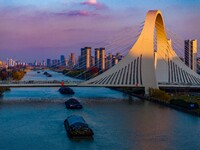 Transport ships sail on the Beijing-Hangzhou Grand Canal in Huai'an City, Jiangsu Province, China, on December 18, 2024. (