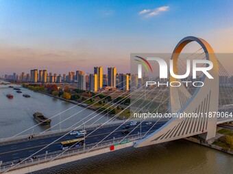 Transport ships sail on the Beijing-Hangzhou Grand Canal in Huai'an City, Jiangsu Province, China, on December 18, 2024. (