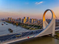 Transport ships sail on the Beijing-Hangzhou Grand Canal in Huai'an City, Jiangsu Province, China, on December 18, 2024. (