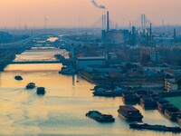 Transport ships sail on the Beijing-Hangzhou Grand Canal in Huai'an City, Jiangsu Province, China, on December 18, 2024. (