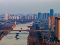 Transport ships sail on the Beijing-Hangzhou Grand Canal in Huai'an City, Jiangsu Province, China, on December 18, 2024. (