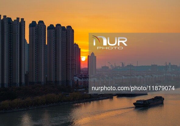 Transport ships sail on the Beijing-Hangzhou Grand Canal in Huai'an City, Jiangsu Province, China, on December 18, 2024. 