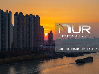 Transport ships sail on the Beijing-Hangzhou Grand Canal in Huai'an City, Jiangsu Province, China, on December 18, 2024. (