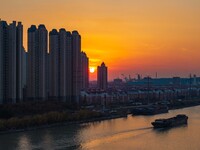 Transport ships sail on the Beijing-Hangzhou Grand Canal in Huai'an City, Jiangsu Province, China, on December 18, 2024. (