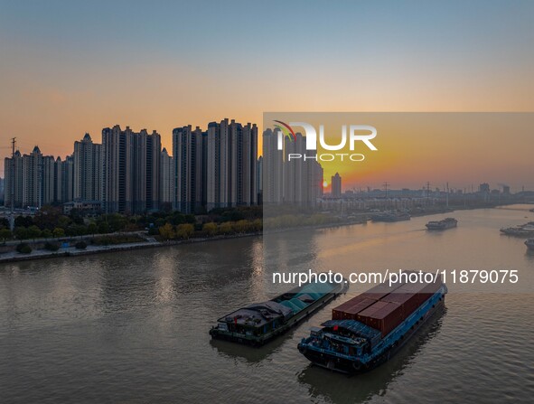 Transport ships sail on the Beijing-Hangzhou Grand Canal in Huai'an City, Jiangsu Province, China, on December 18, 2024. 