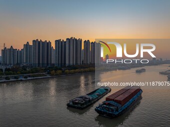 Transport ships sail on the Beijing-Hangzhou Grand Canal in Huai'an City, Jiangsu Province, China, on December 18, 2024. (