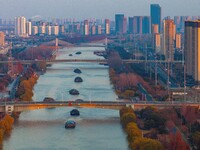 Transport ships sail on the Beijing-Hangzhou Grand Canal in Huai'an City, Jiangsu Province, China, on December 18, 2024. (