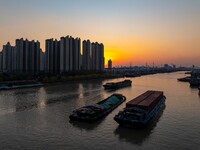 Transport ships sail on the Beijing-Hangzhou Grand Canal in Huai'an City, Jiangsu Province, China, on December 18, 2024. (