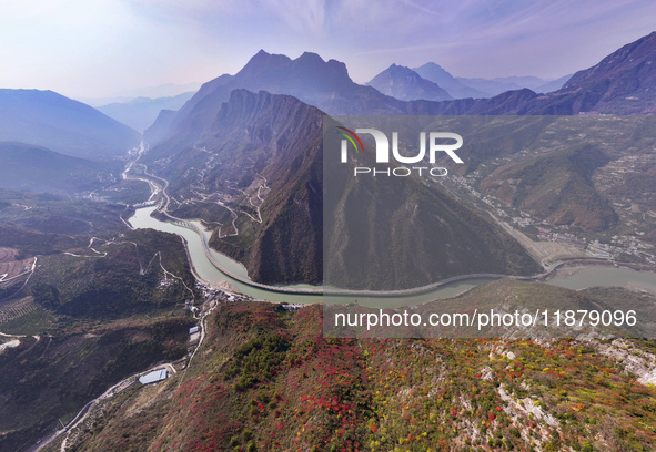 Vehicles drive on the Guzhao water highway in Xingshan County, Yichang City, Central China's Hubei Province, on December 18, 2024. 