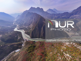 Vehicles drive on the Guzhao water highway in Xingshan County, Yichang City, Central China's Hubei Province, on December 18, 2024. (