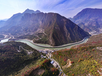 Vehicles drive on the Guzhao water highway in Xingshan County, Yichang City, Central China's Hubei Province, on December 18, 2024. (