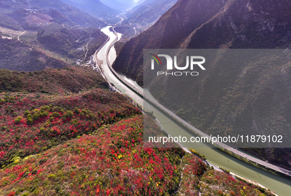 Vehicles drive on the Guzhao water highway in Xingshan County, Yichang City, Central China's Hubei Province, on December 18, 2024. 