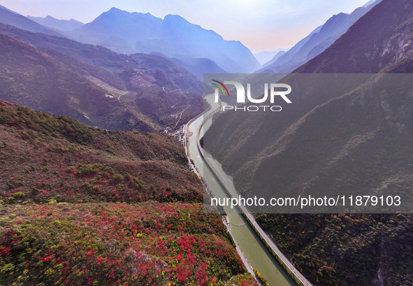 Vehicles drive on the Guzhao water highway in Xingshan County, Yichang City, Central China's Hubei Province, on December 18, 2024. 