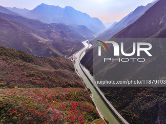 Vehicles drive on the Guzhao water highway in Xingshan County, Yichang City, Central China's Hubei Province, on December 18, 2024. (