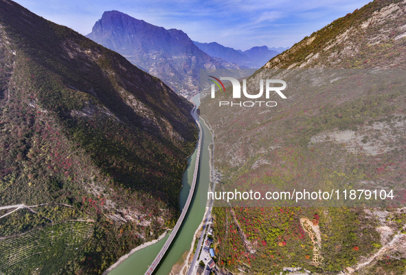 Vehicles drive on the Guzhao water highway in Xingshan County, Yichang City, Central China's Hubei Province, on December 18, 2024. 