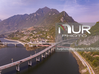 Vehicles drive on the Guzhao water highway in Xingshan County, Yichang City, Central China's Hubei Province, on December 18, 2024. (