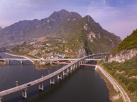 Vehicles drive on the Guzhao water highway in Xingshan County, Yichang City, Central China's Hubei Province, on December 18, 2024. (