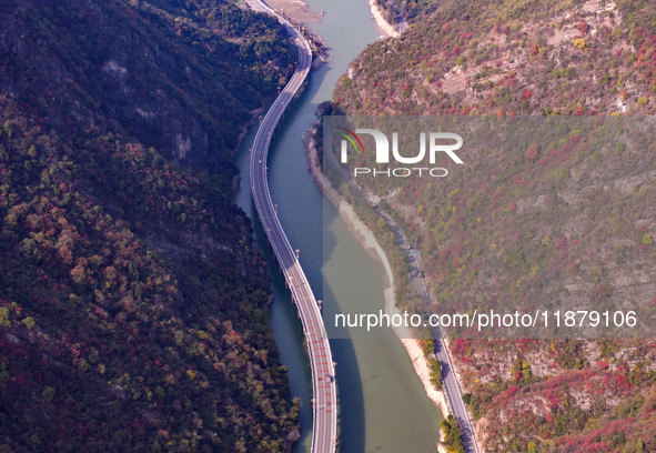 Vehicles drive on the Guzhao water highway in Xingshan County, Yichang City, Central China's Hubei Province, on December 18, 2024. 